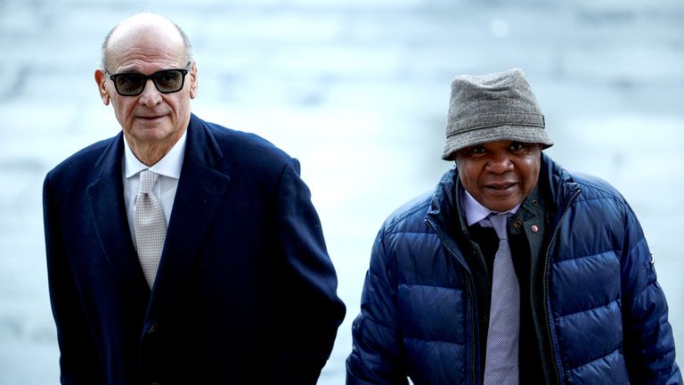 Patrick Lumumba and his lawyer Carlo Pacelli walk near Italy's top appeals court.
Pic: Reuters