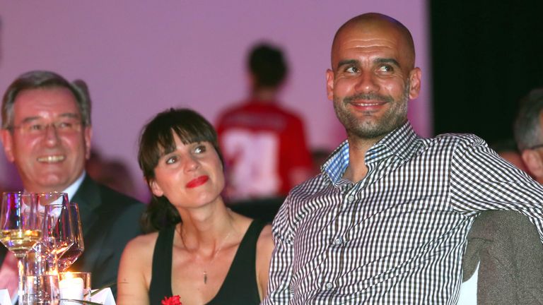 In this picture taken Saturday May 10, 2014 Bayern Munich soccer coach Pep Guardiola, from Spain, right, and his wife Cristina Serra attend the official Champions party in Munich, Germany. (AP Photo/Alexander Hassenstein,Pool)


