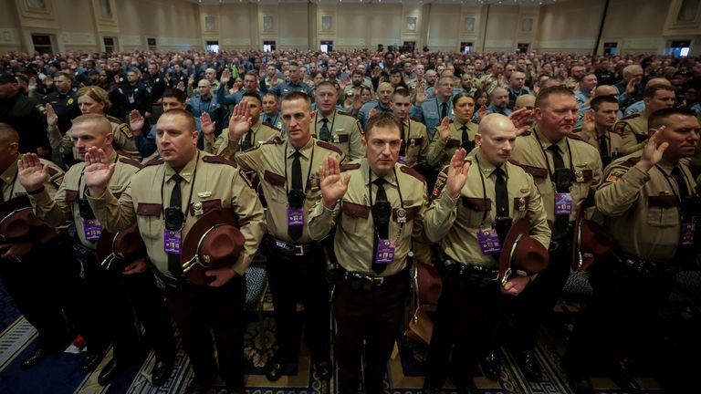 Officers from the Georgia State Police along with thousands of other external law enforcement officers from across the United States attend a swearing-in ceremony ahead of performing security duties in Washington during the Inauguration of U.S. President-elect Donald Trump, in Oxon Hill, Maryland, U.S., January 19, 2025. REUTERS/Mike Segar