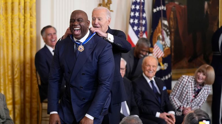 President Joe Biden presents the Presidential Medal of Freedom to Earvin 'Magic' Johnson. Pic: AP