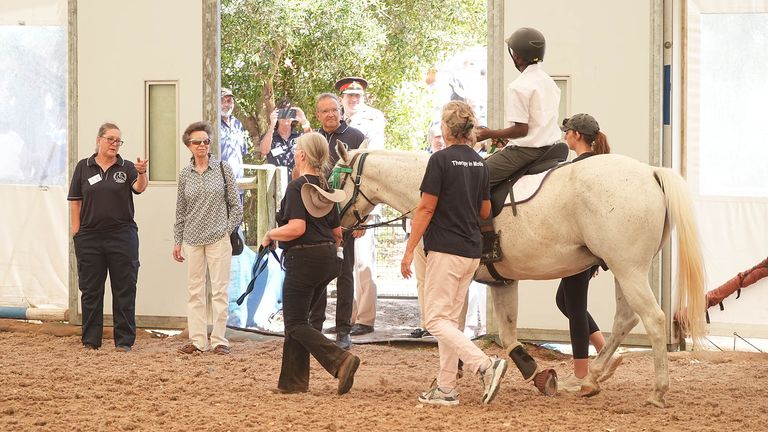 The Princess Royal views a riding lesson during a visit to the South African Riding School for Disabled Association (SARDA) while on her two-day to trip to South Africa. 
Pic: PA