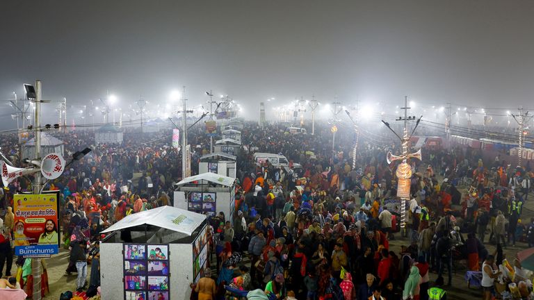 Devotees gather on the day they take a holy dip at Sangam, the confluence of the Ganges and Yamuna rivers with the mythical, invisible Saraswati river, during the "Maha Kumbh Mela", or the Great Pitcher Festival, in Prayagraj, India, January 13, 2025. REUTERS/Anushree Fadnavis

