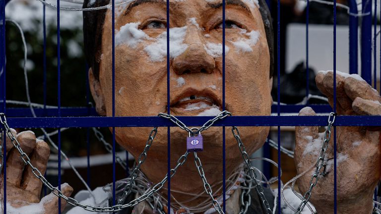 An effigy of impeached South Korean President Yoon Suk Yeol is covered in snow during a protest against him near his official residence on a snowy day in Seoul, South Korea, January 5, 2025. REUTERS/Tyrone Siu