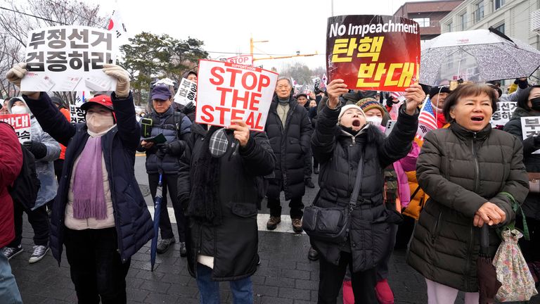 Supporters of impeached South Korean President Yoon Suk Yeol attend a rally to oppose his impeachment near the presidential residence in Seoul, South Korea, Sunday, Jan. 5, 2025. (AP Photo/Ahn Young-joon)