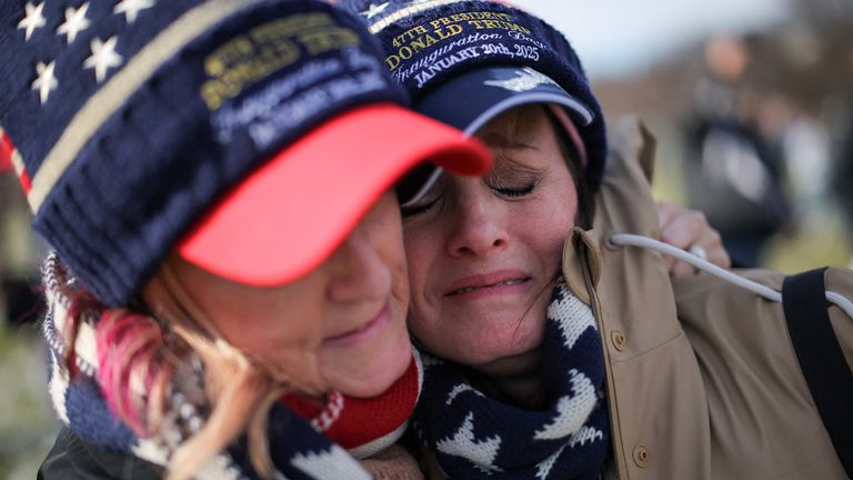 Tammy Holt and Vicky Askew, from Alabama, react after Donald Trump was sworn in at his inauguration ceremony