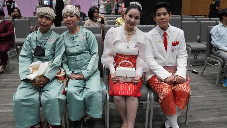 Couples wait for their marriage certificates. Pic: AP