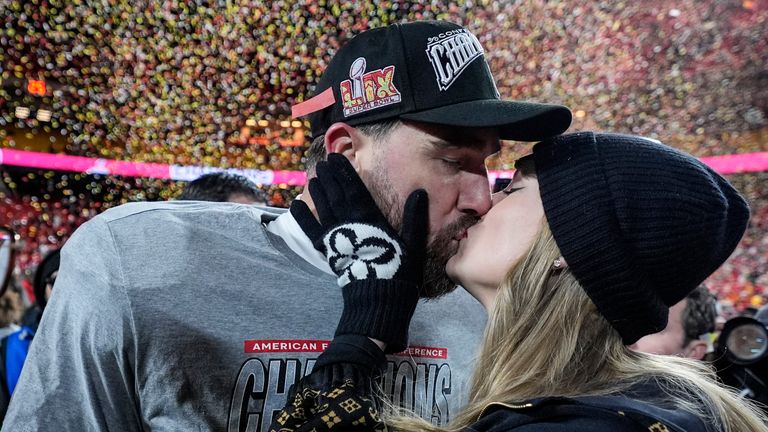 Kansas City Chiefs tight end Travis Kelce and Taylor Swift kiss after the AFC Championship NFL football game against the Buffalo Bills, Sunday, Jan. 26, 2025, in Kansas City, Mo. (AP Photo/Ashley Landis)