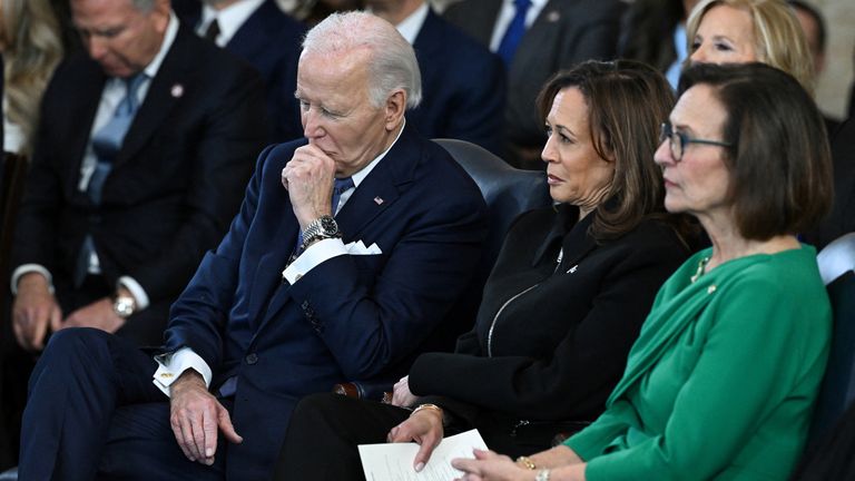 The outgoing president and vice president looked unimpressed with Mr Trump's speech. Pic: Reuters