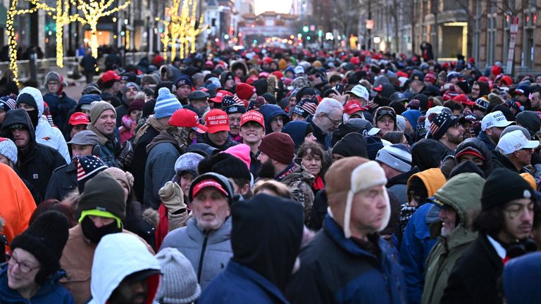 Crowds of supporters brave the cold to watch a live broadcast of the ceremony. Pic: AP