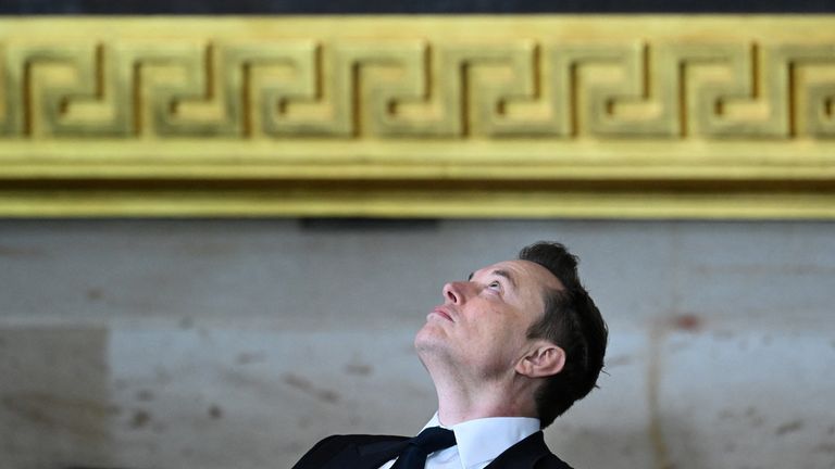 Elon Musk waits for Donald Trump to arrive for his inauguration in the Rotunda. Pic: Reuters