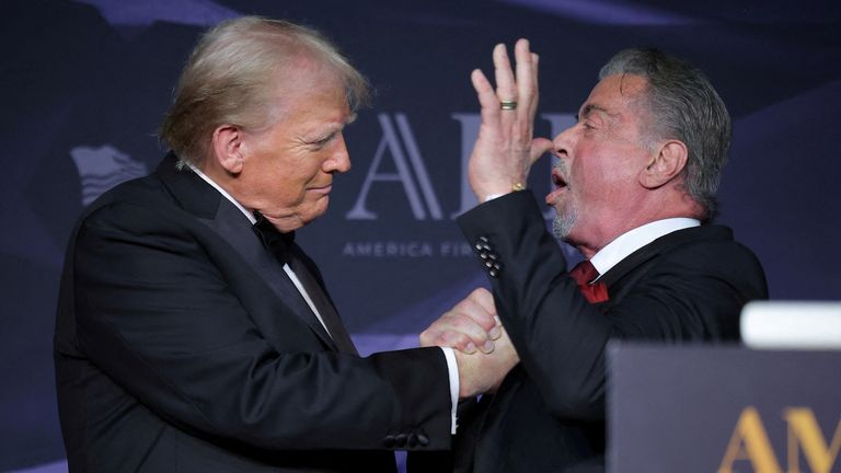 Donald Trump greets actor Sylvester Stallone at a gala at Mar-A-Lago in November. Pic: Reuters
