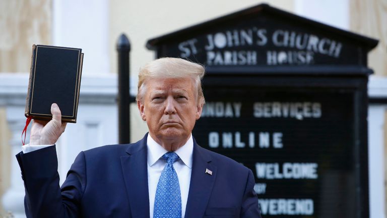 FILE - President Donald Trump holds a Bible as he visits outside St. John's Church, June 1, 2020, in Washington. (AP Photo/Patrick Semansky, File)