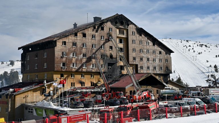 Firefighters work at the scene after a fire broke out at a hotel in the ski resort of Kartalkaya, located in Bolu province, northwest Turkey, on Tuesday, Jan. 21, 2025. (Mert Gokhan Koc/DIA Photo via AP)