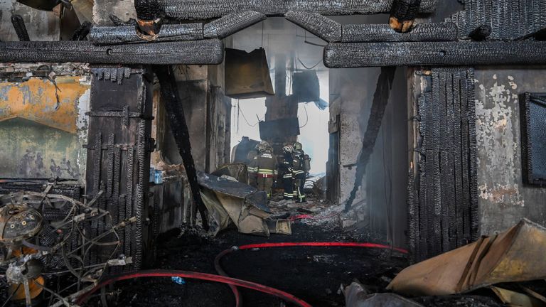 Firefighters work at the scene after a fire broke out at a hotel in the ski resort of Kartalkaya, located in Bolu province, northwest Turkey, on Tuesday, Jan. 21, 2025. (Mert Gokhan Koc/DIA Photo via AP)