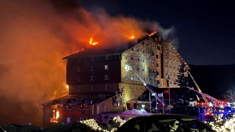 Firefighters work to extinguish a fire at a hotel in the ski resort of Kartalkaya in Bolu, Turkey.
Pic: Reuters