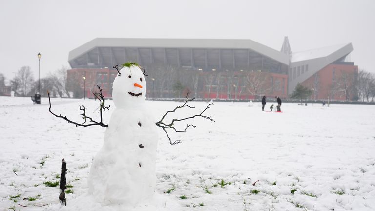 People play in the snow in Stanley Park at Anfield in Liverpool. Pic: PA