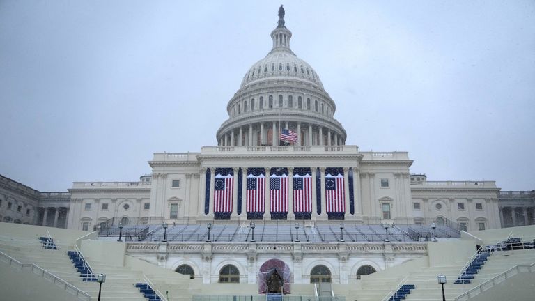 A general view shows the West Front of the U.S. Capitol building during snowfall a day before U.S. President-elect Donald Trump is scheduled to be inaugurated for a second term, in Washington, U.S., January 19, 2025. REUTERS/Fabrizio Bensch .