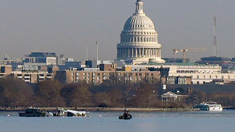 Search and rescue efforts are seen around a wreckage site in the Potomac River from Ronald Reagan Washington National Airport, early Thursday morning, Jan. 30, 2025, in Arlington, Va. (AP Photo/Carolyn Kaster)