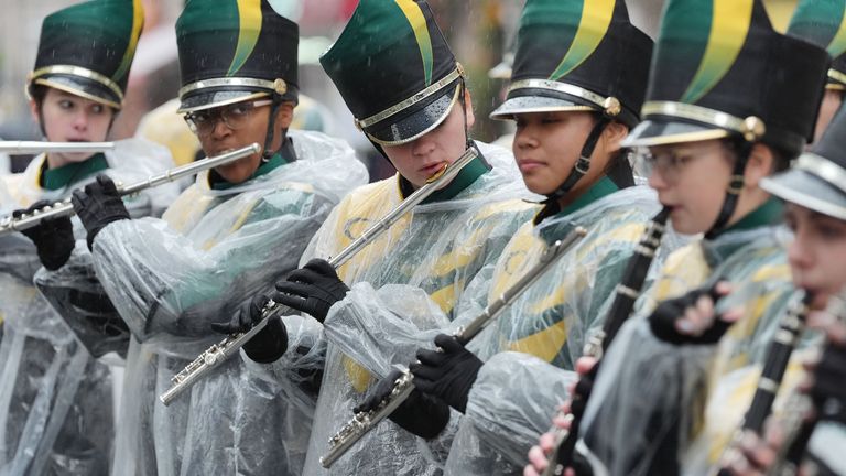 Rain falls as performers prepare to take part in the New Year's Day Parade in central London. Pic: PA