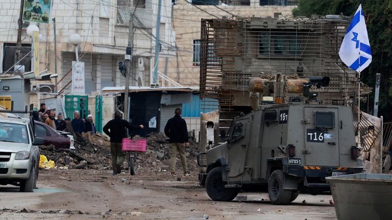 An Israeli military vehicle operates at a checkpoint on the day of an Israeli raid in Jenin, in the Israeli-occupied West Bank.
Pic: Reuters