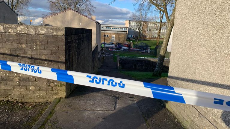 Police at the scene in Harburn Drive, West Calder, following the death of a 36-year-old man and six-year-old girl.