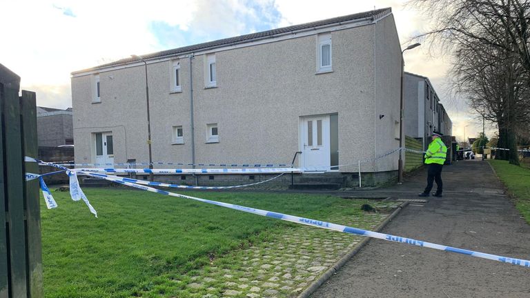 Police at the scene in Harburn Drive, West Calder, following the death of a 36-year-old man and six-year-old girl.