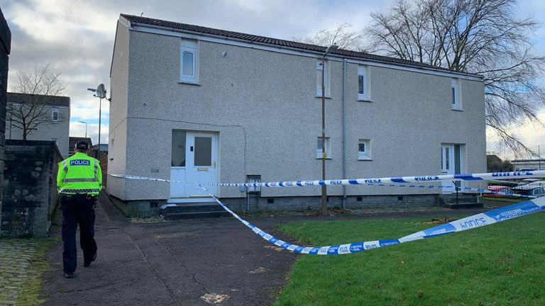 Police at the scene in Harburn Drive, West Calder, following the death of a 36-year-old man and six-year-old girl.