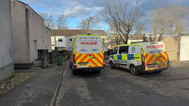 Police at the scene in Harburn Drive, West Calder, following the death of a 36-year-old man and six-year-old girl.