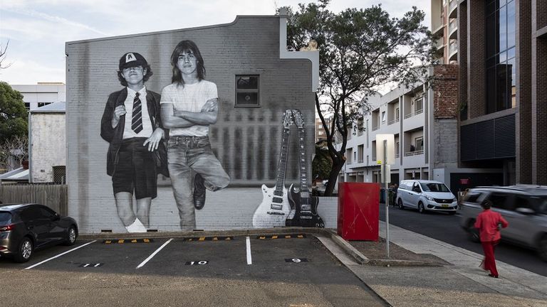 Angus, left, and Malcom Young on the Burleigh Street mural. Pic: Burwood Council