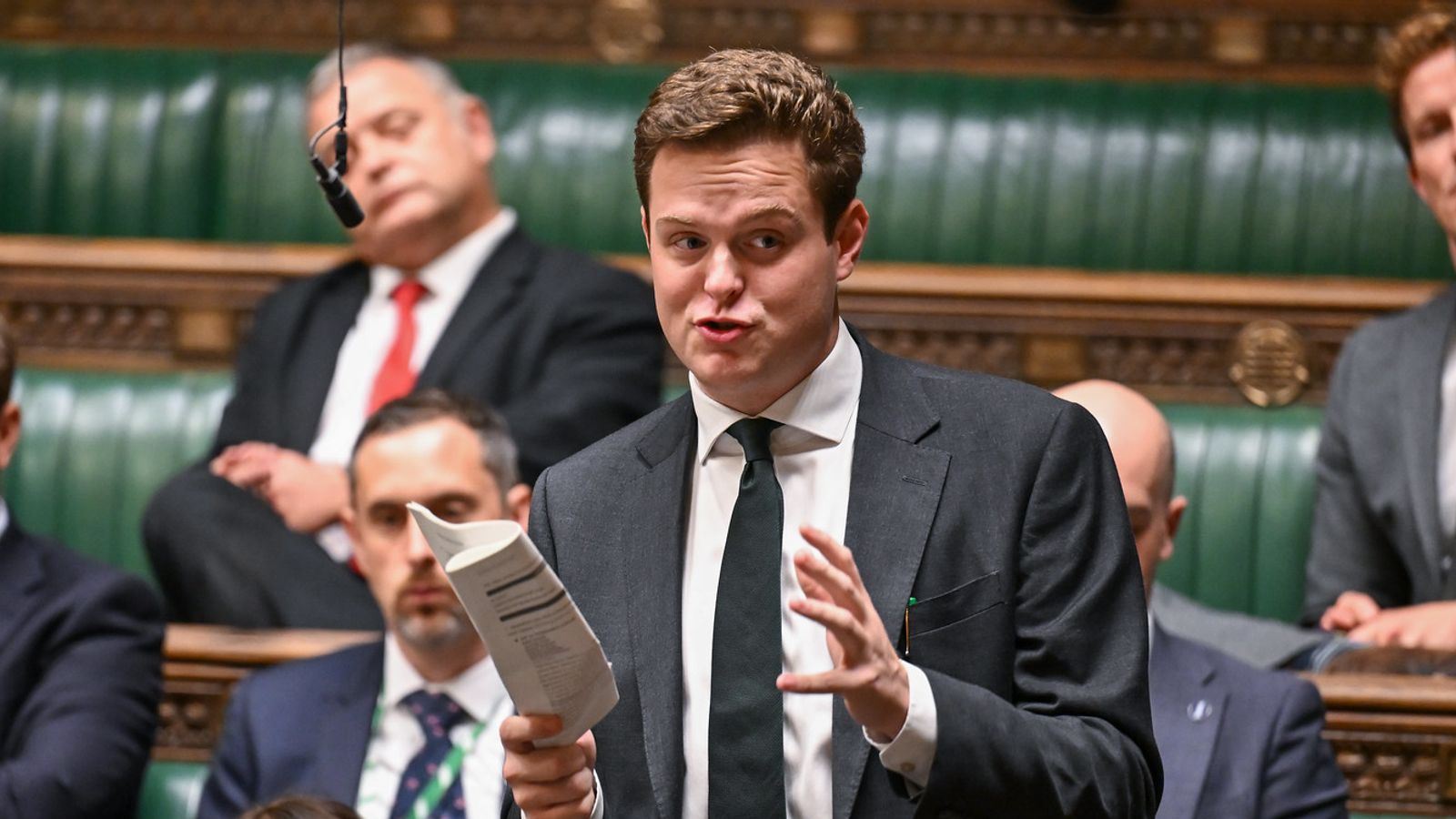 arafed man in a suit and tie speaking in a parliament