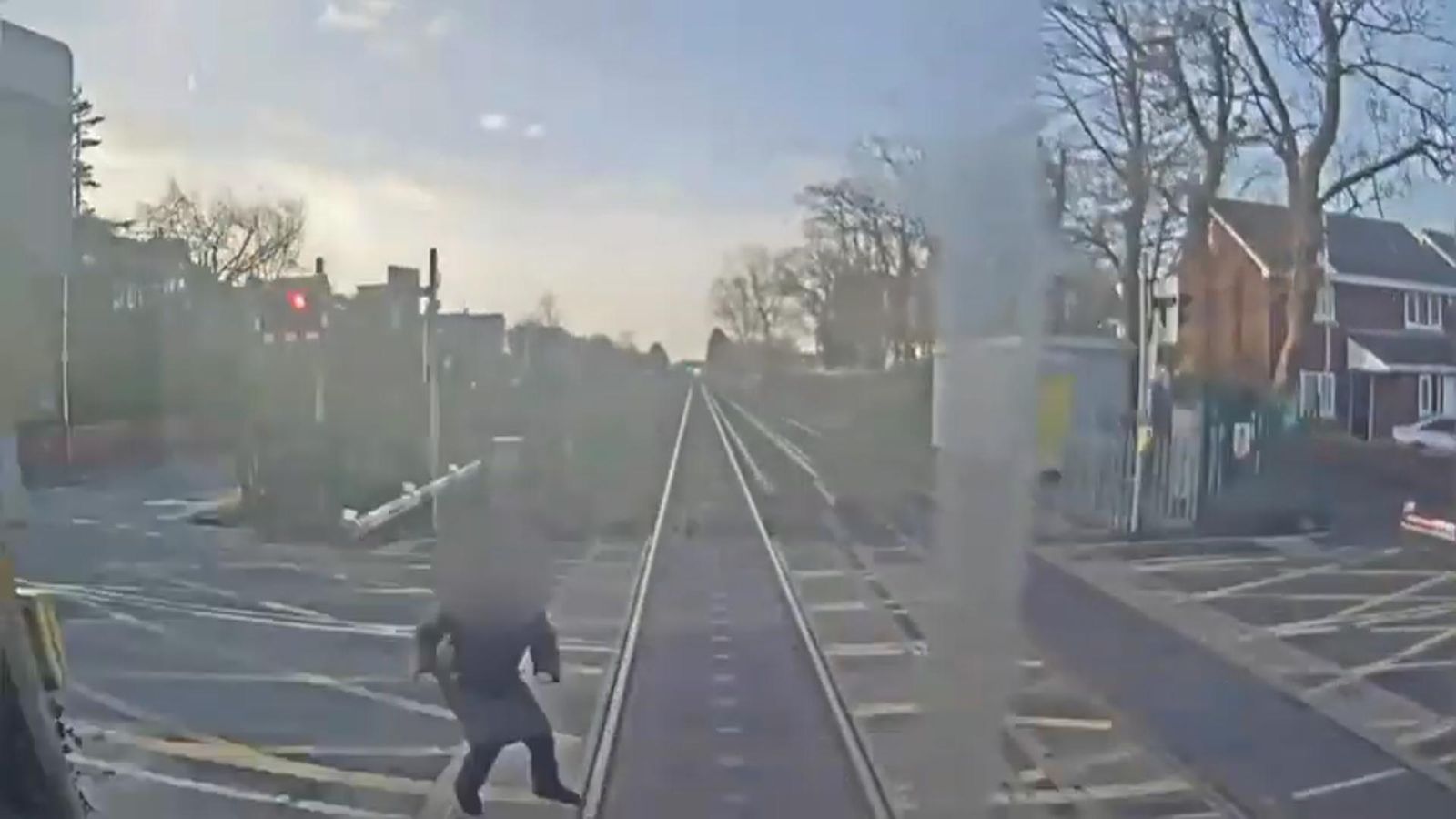 Train nearly hits woman at level crossing in Southport | News UK Video ...