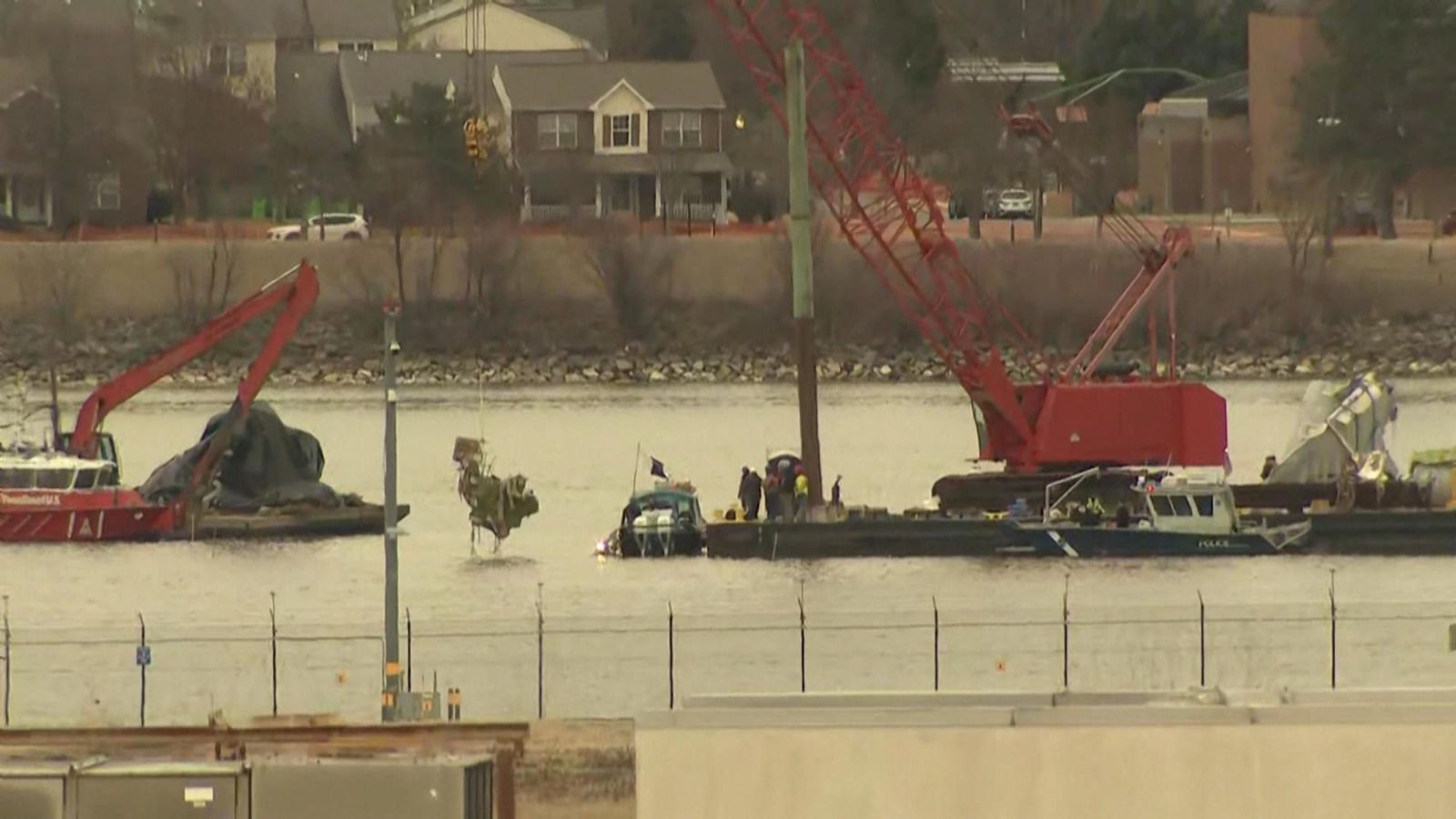 Workers pull American Airlines plane wreckage recovered from Washington ...