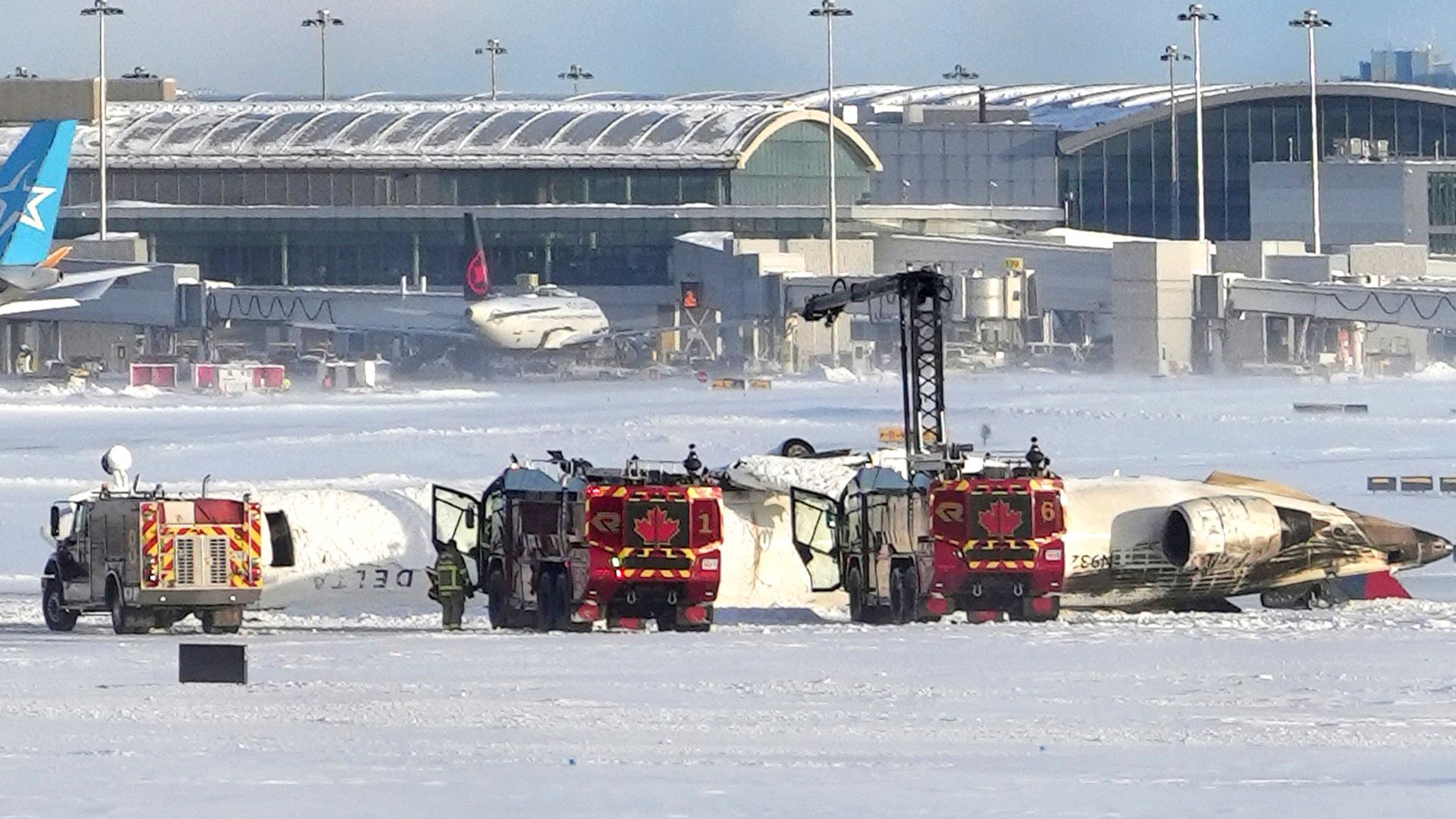 Plane crashes and flips at Toronto airport, leaving 18 injured
