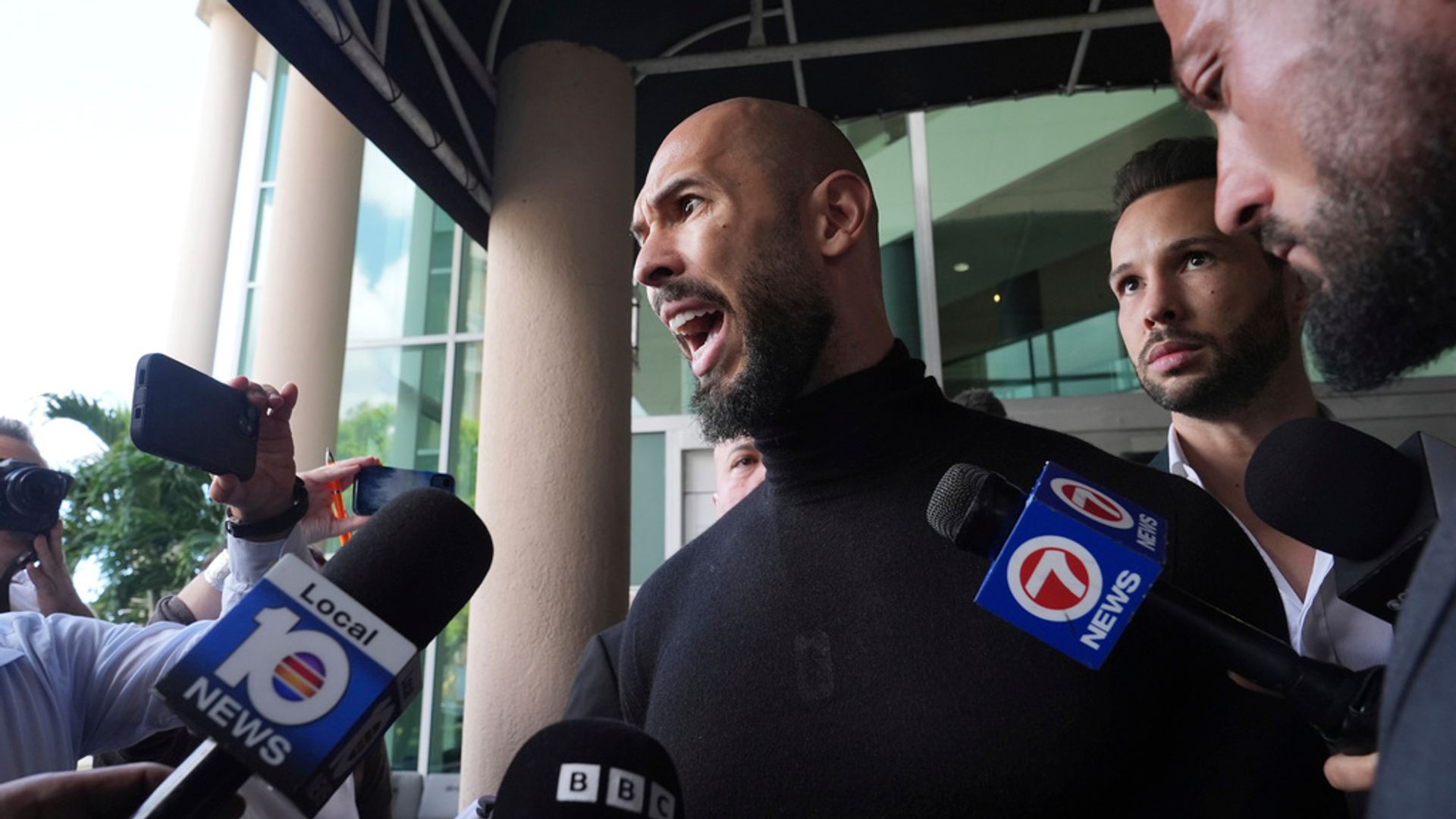 Andrew Tate arrives in US after travel ban was lifted - as Trump says he knows 'nothing about that'