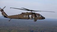 United States Army Soldiers fly in a Black Hawk helicopter over Muskegon after completing their rout around a fictitious foreign ship docked in a port in Lake Muskegon, loaded with pseudo hazardous material in an emergency management consequence training exercise during the mock disaster on Sept. 24, 2014. (AP Photo/The Muskegon Chronicle, Andraya Croft)


