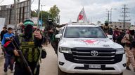 Hamas fighters escort Red Cross vehicles before the release of three Israeli hostages last week. Pic: AP