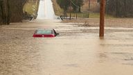 This photo provided by the Warren County, Ky., Sheriff's Office shows a partially submerged car outside of Bowling Green, Ky., on Saturday, Feb. 15, 2025. (Warren County Sheriff's Office via AP)