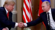 U.S. President Donald Trump and Russia's President Vladimir Putin shake hands as they meet in Helsinki, Finland July 16, 2018. REUTERS/Kevin Lamarque/File Photo