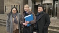 Theresa and Matthew Smith with their lawyer outside Glasgow Sheriff Court