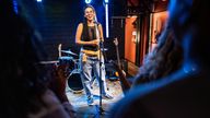 woman talking during stand-up comedy show 