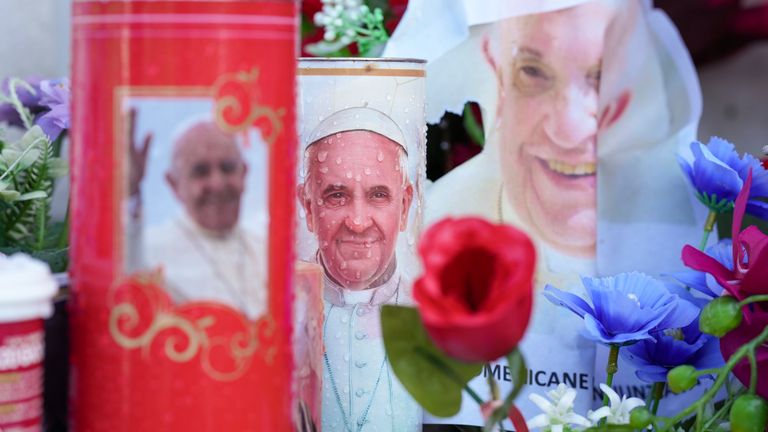 Candles and flowers for Pope Francis are seen at the Agostino Gemelli Polyclinic, in Rome, Wednesday, February 26, 2025, where the Pontiff has been admitted to hospital since Friday, February 14 (AP Photo/Andrew Medichini)