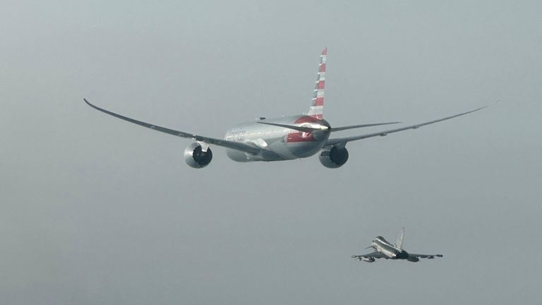 An Italian Air Force Eurofighter aircraft escorts an American Airlines plane in this handout photo obtained by Reuters on February 23, 2025. Italian Air Force/Handout via REUTERS THIS IMAGE HAS BEEN SUPPLIED BY A THIRD PARTY