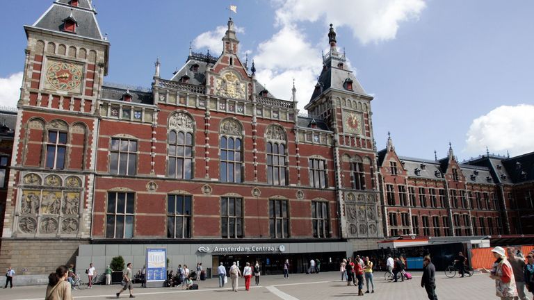 People walking in front at Central Station downtown Amsterdam 14 August, 2013. (Paulo Amorim / VWPics via AP Images)


