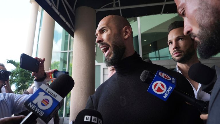 Andrew Tate speaks to reporters after arriving in Florida. Pic: AP