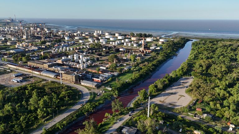 The Sarandi stream, which flows into the Rio de la Plata river, is seen dyed red for unknown reasons, in Buenos Aires, Argentina February 6, 2025. REUTERS/Agustin Marcarian
