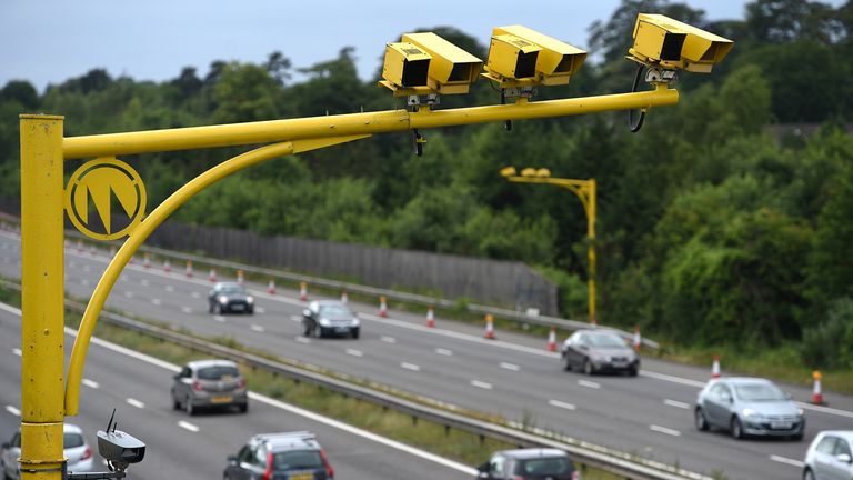 General view of three SPECS Average Speed cameras in position on the M3 motorway in Hampshire.  28-Jun-2015