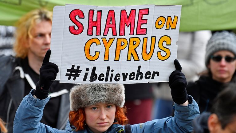 A woman holds a placard during a protest in support of the woman in London. Pic: Reuters