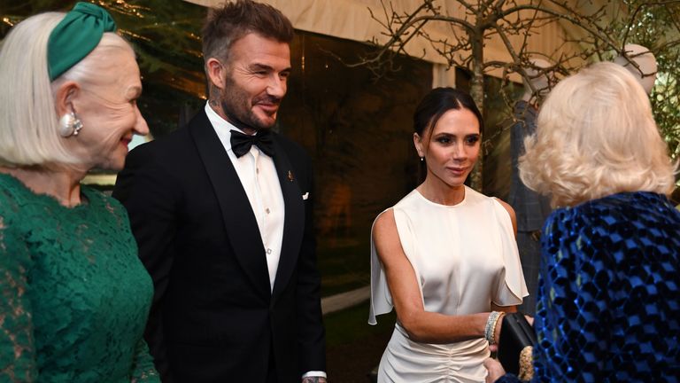 Queen Camilla (right) talks with Dame Helen Mirren (left) and David and Victoria Beckham (obscured), during a dinner in celebration of Slow Food at King Charles III's Gloucestershire estate, Highgrove House, Tetbury, Gloucestershire. Picture date: Friday February 7, 2025.

