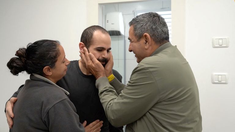 Released Israeli hostage Yarden Bibas embraces loved ones. Pic: Reuters