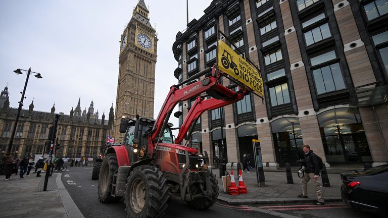 A banner is placed on a tractor near Big Ben.
Pic Reuters